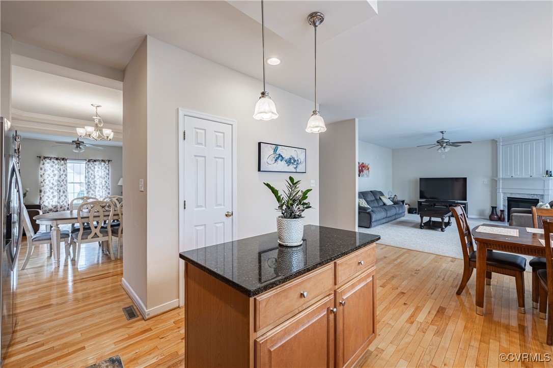 9500 Meadowview Road Henrico, VA 23294 - Photo 21 of 49 a view of a dining room and livingroom with furniture wooden floor a chandelier