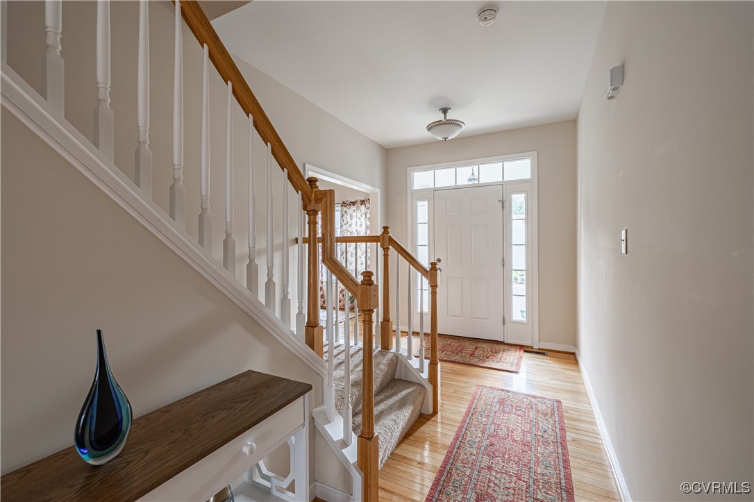 9500 Meadowview Road Henrico, VA 23294 - Photo 29 of 49 a view of entryway and hall with wooden floor
