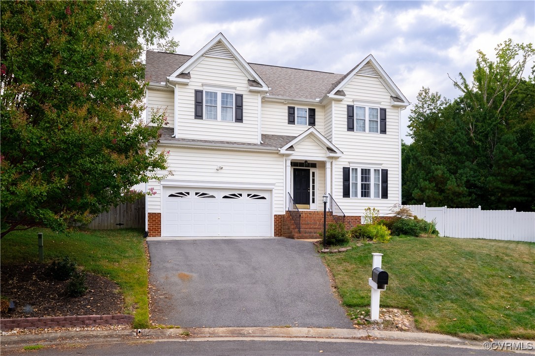 9500 Meadowview Road Henrico, VA 23294 - Photo 3 of 49 a front view of a house with a yard and garage