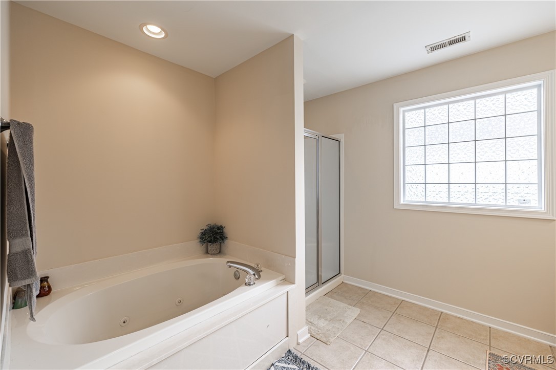 9500 Meadowview Road Henrico, VA 23294 - Photo 39 of 49 a bathroom with a bathtub a window and a shower