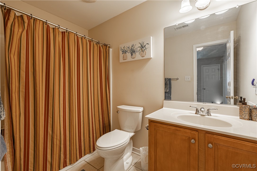 9500 Meadowview Road Henrico, VA 23294 - Photo 43 of 49 a bathroom with a sink a toilet and shower