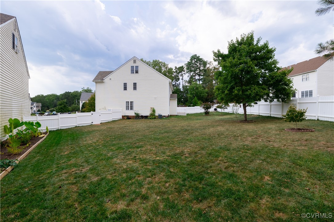 9500 Meadowview Road Henrico, VA 23294 - Photo 6 of 49 a white house with a big yard and large trees