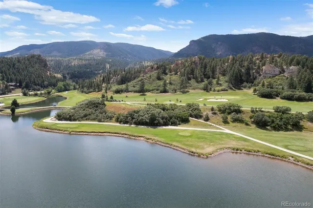 a view of a house with a yard and a swimming pool