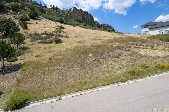 a view of a road with a yard