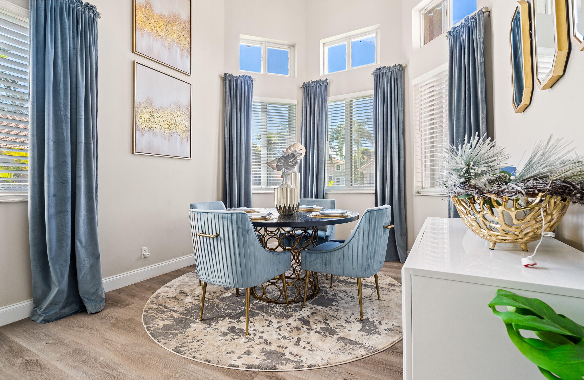 15822 Southwest 10th Street Pembroke Pines, FL 33027 - Photo 16 of 37 a dining room with wooden floor a glass table and chairs