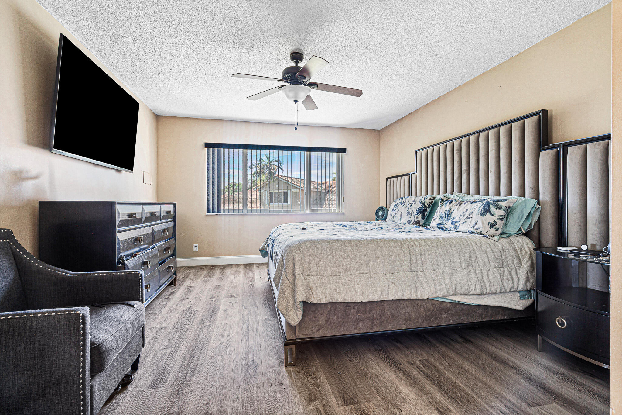 15822 Southwest 10th Street Pembroke Pines, FL 33027 - Photo 17 of 37 a spacious bedroom with a bed and a flat screen tv