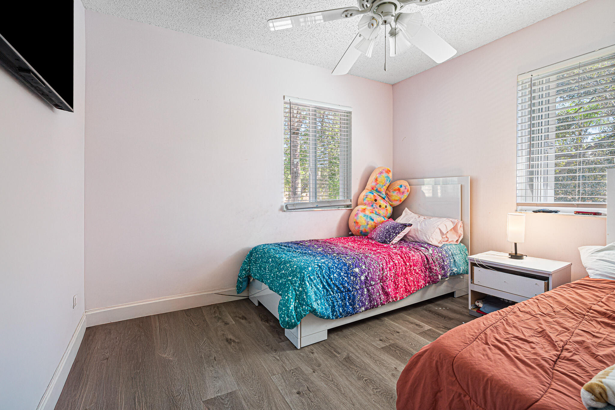 15822 Southwest 10th Street Pembroke Pines, FL 33027 - Photo 19 of 37 a bedroom with two beds and a chandelier