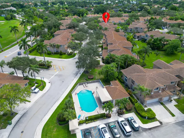 an aerial view of house with swimming pool and outdoor seating