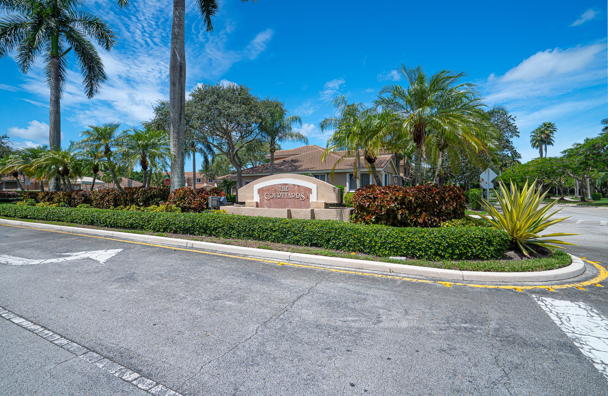 15822 Southwest 10th Street Pembroke Pines, FL 33027 - Photo 34 of 37 a front view of a house with a yard and palm tree