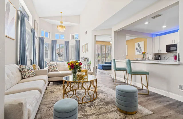 a living room with furniture and a large window