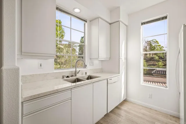 a kitchen with a sink and cabinets