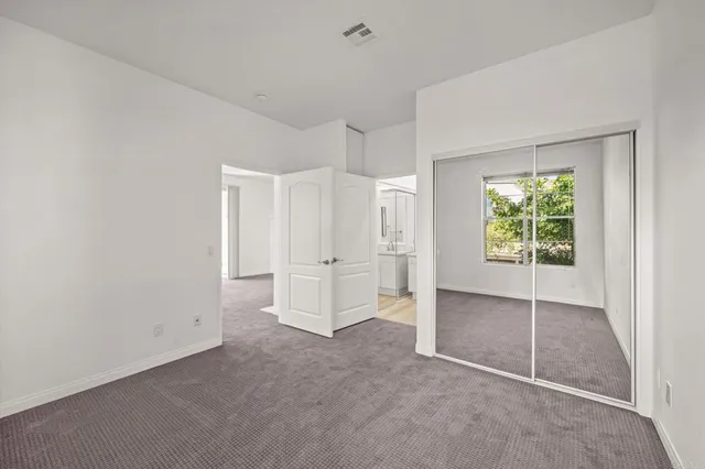 a view of empty room with windows