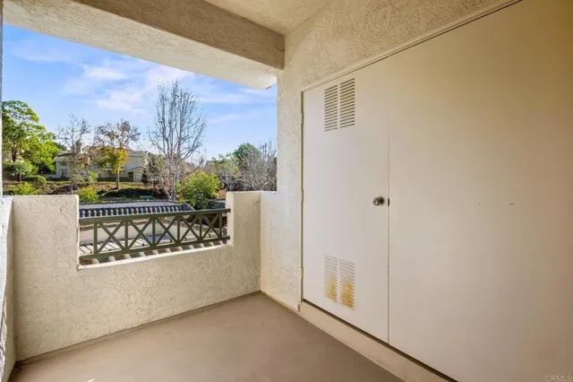 a view of a porch with wooden floor