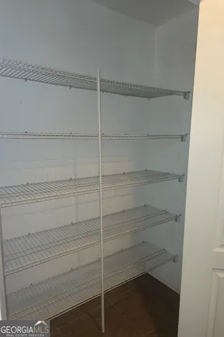 a bedroom with a bed and a cabinets