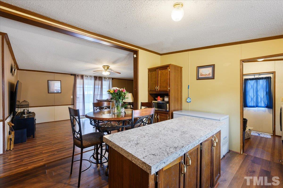 6604 Stokes Road Middlesex, NC 27557 - Photo 5 of 15 a kitchen with a table and chairs in it
