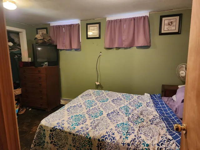 a bedroom with a bed and a closet