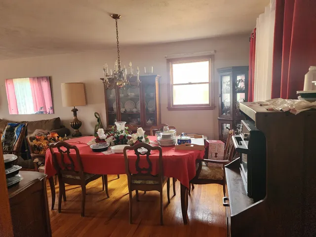 a view of a dining room with furniture and window
