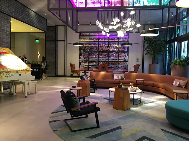 a living room with fireplace furniture and a chandelier