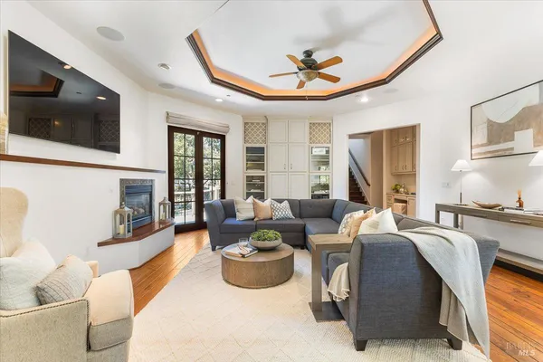 a living room with fireplace furniture and a flat screen tv