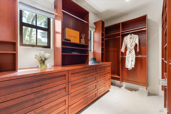 a spacious bedroom with a bed and a couch