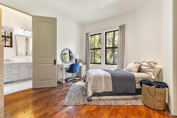 a bathroom with a sink double vanity and a mirror