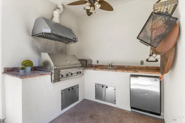 a view of a chair and tables on the roof deck