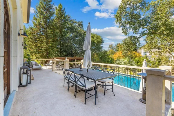 a view of a house with backyard and furniture