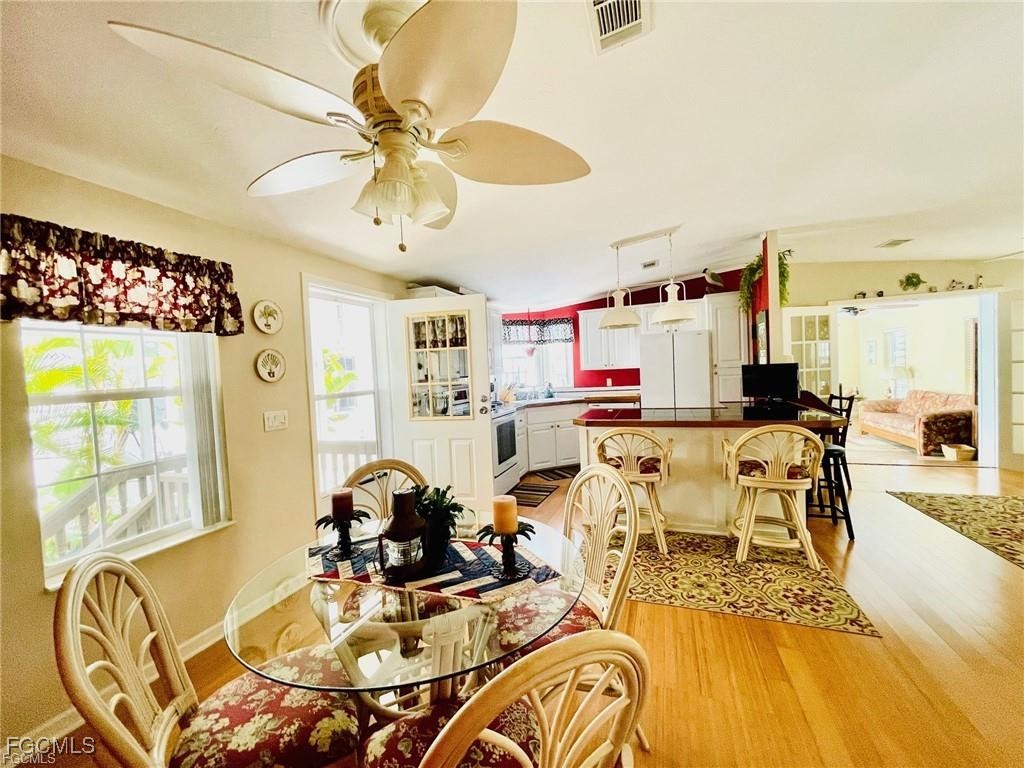 3064 Sloop Lane St. James City, FL 33956 - Photo 11 of 30 a living room with lots of furniture and kitchen view