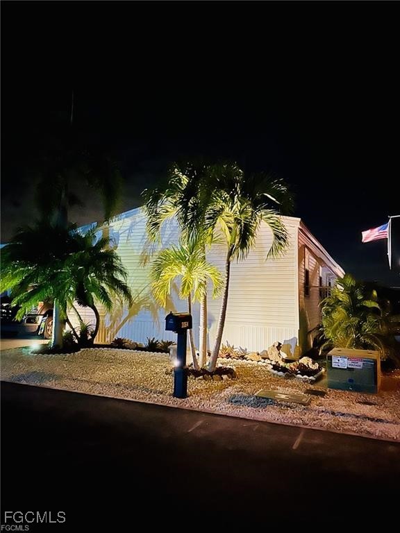 3064 Sloop Lane St. James City, FL 33956 - Photo 30 of 30 a view of a palm tree in front of a house