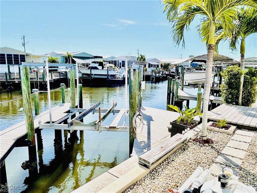 3064 Sloop Lane St. James City, FL 33956 - Photo 6 of 30 a view of balcony with two chairs and potted plants