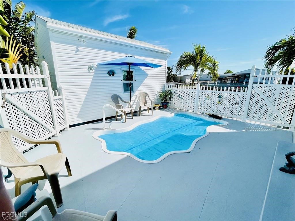 3064 Sloop Lane St. James City, FL 33956 - Photo 9 of 30 a view of a house with a patio