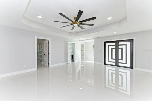 a view of a kitchen with a sink and a large window