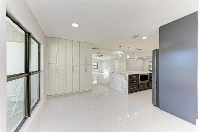 a utility room with sink dryer and washer