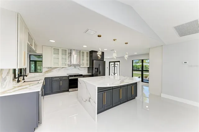 a view of a livingroom with furniture and a ceiling fan