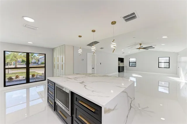 a white bath tub sitting next to a shower
