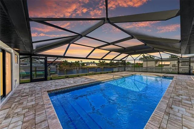 a view of a swimming pool with a porch