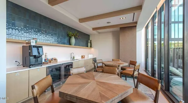 a room with furniture wooden floor and a table