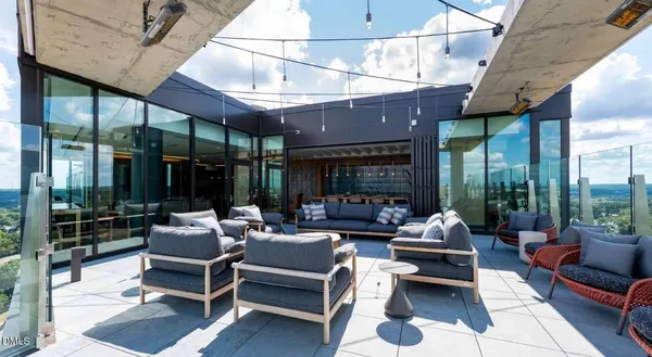 a kitchen with a table chairs and refrigerator
