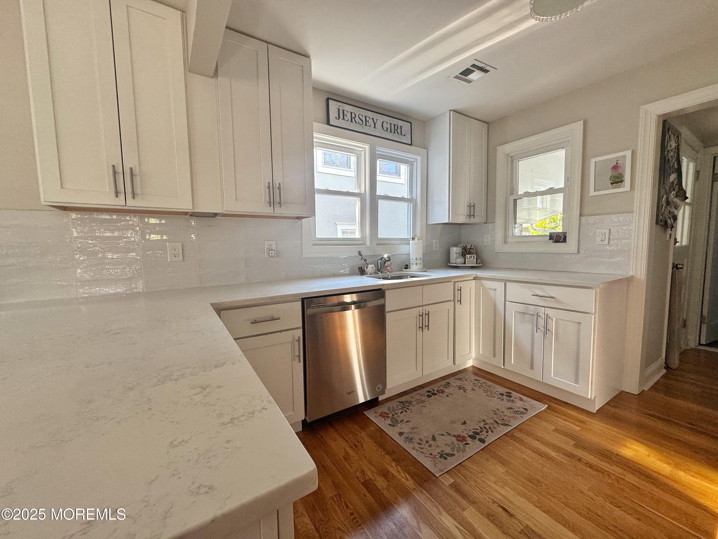 59 Leroy Place Red Bank, NJ 07701 - Photo 13 of 37 a kitchen with a sink stove and cabinets