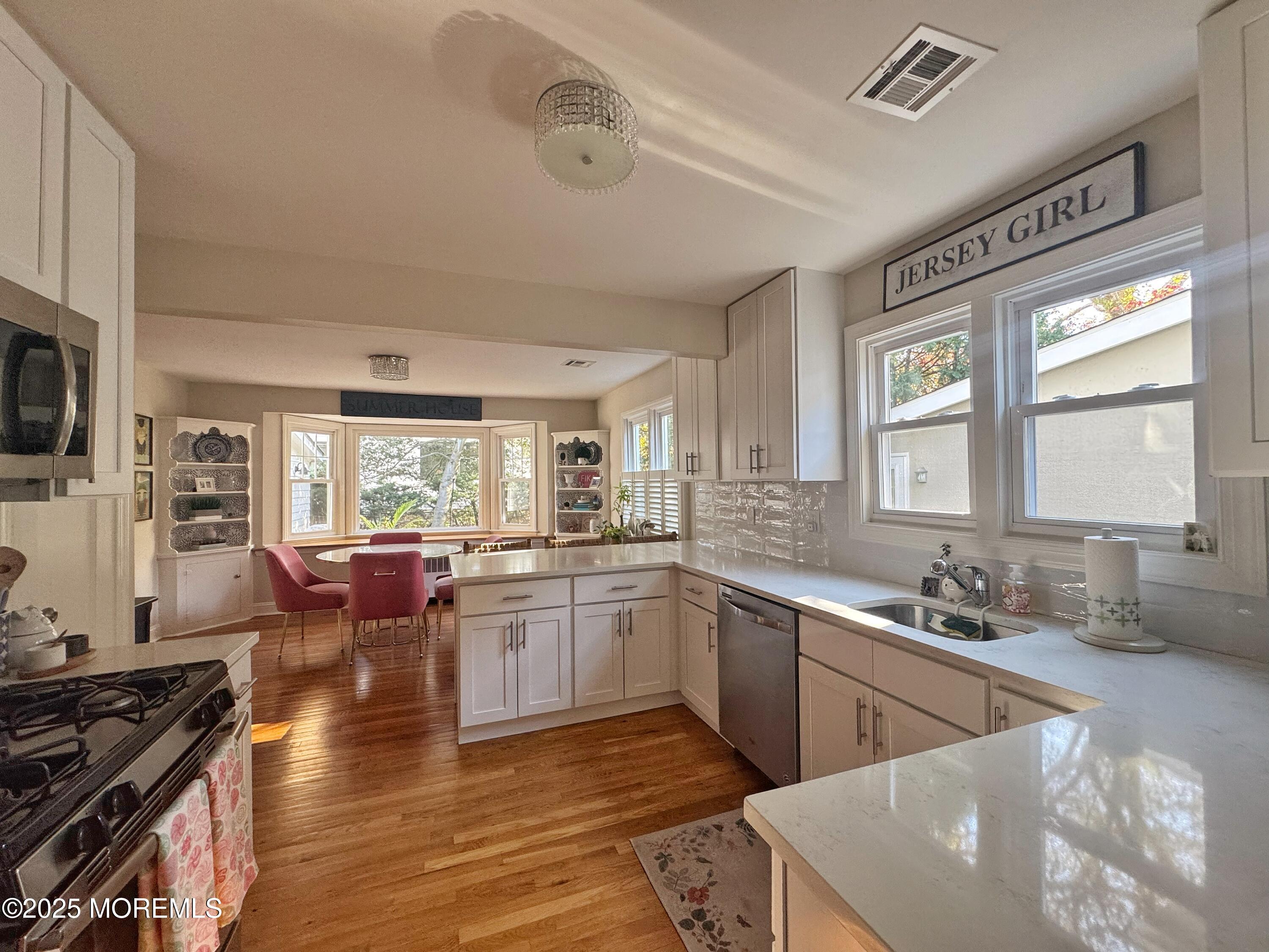 59 Leroy Place Red Bank, NJ 07701 - Photo 15 of 37 a large kitchen with a large window and stainless steel appliances