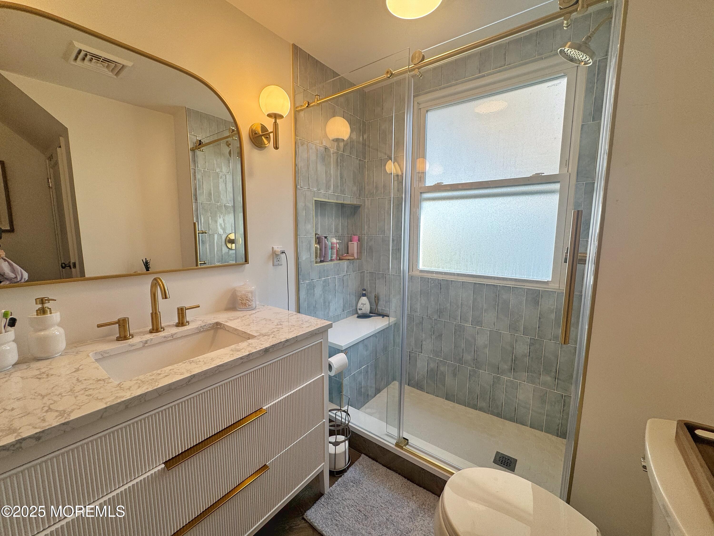 59 Leroy Place Red Bank, NJ 07701 - Photo 24 of 37 a bathroom with a granite countertop sink toilet and shower