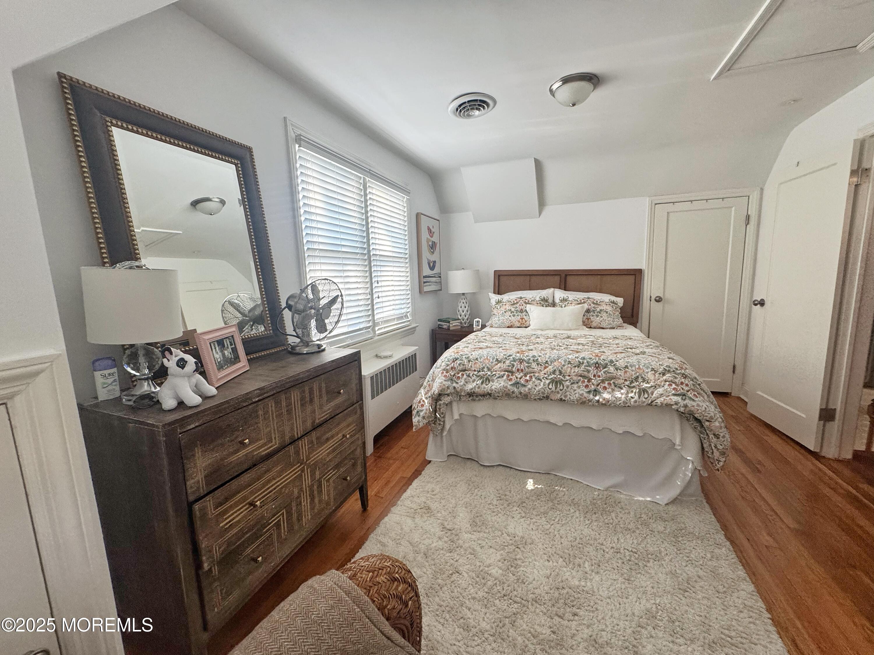 59 Leroy Place Red Bank, NJ 07701 - Photo 27 of 37 a bedroom with a bed and a mirror on the dresser