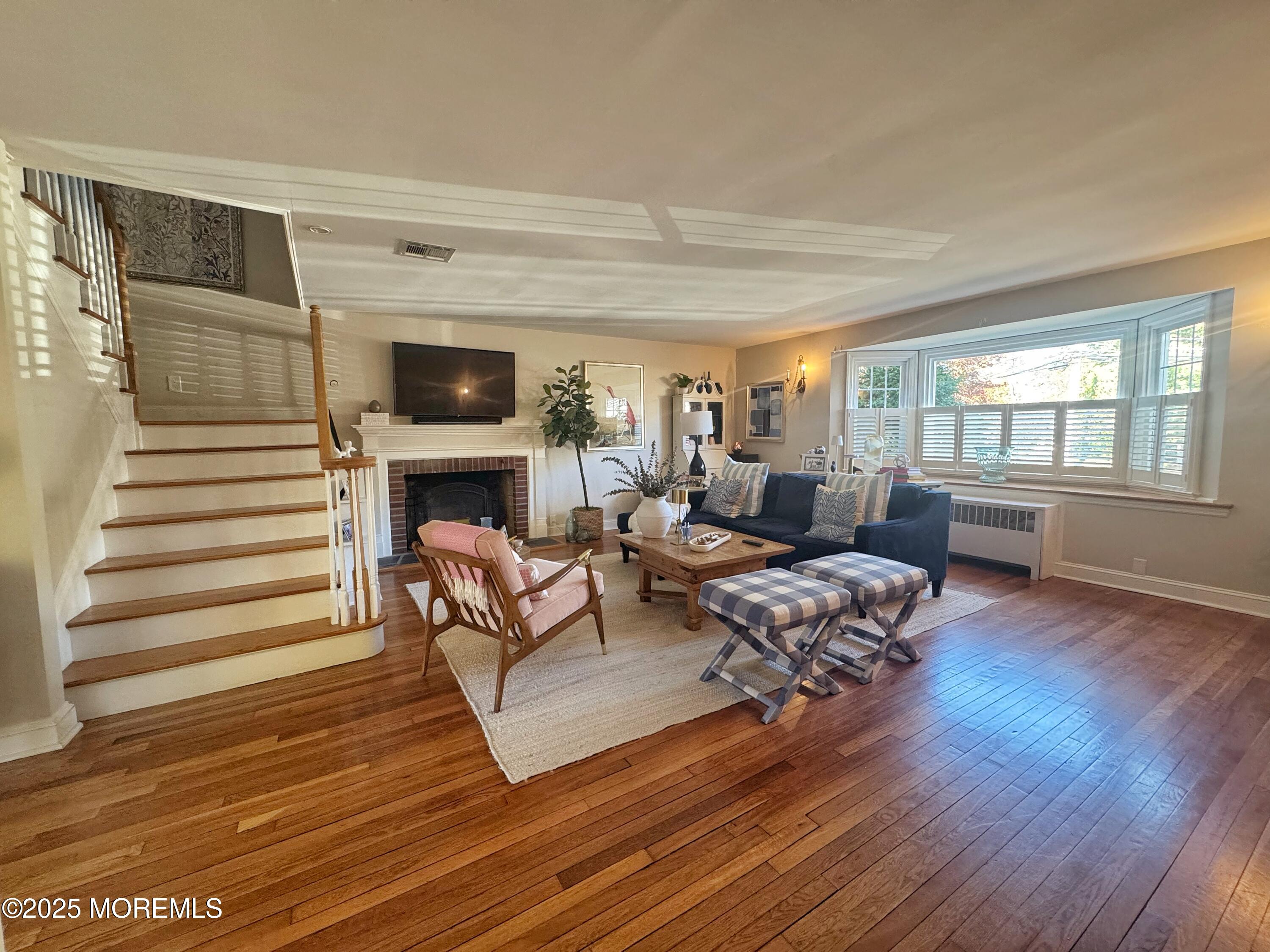 59 Leroy Place Red Bank, NJ 07701 - Photo 5 of 37 a living room with furniture and a fireplace