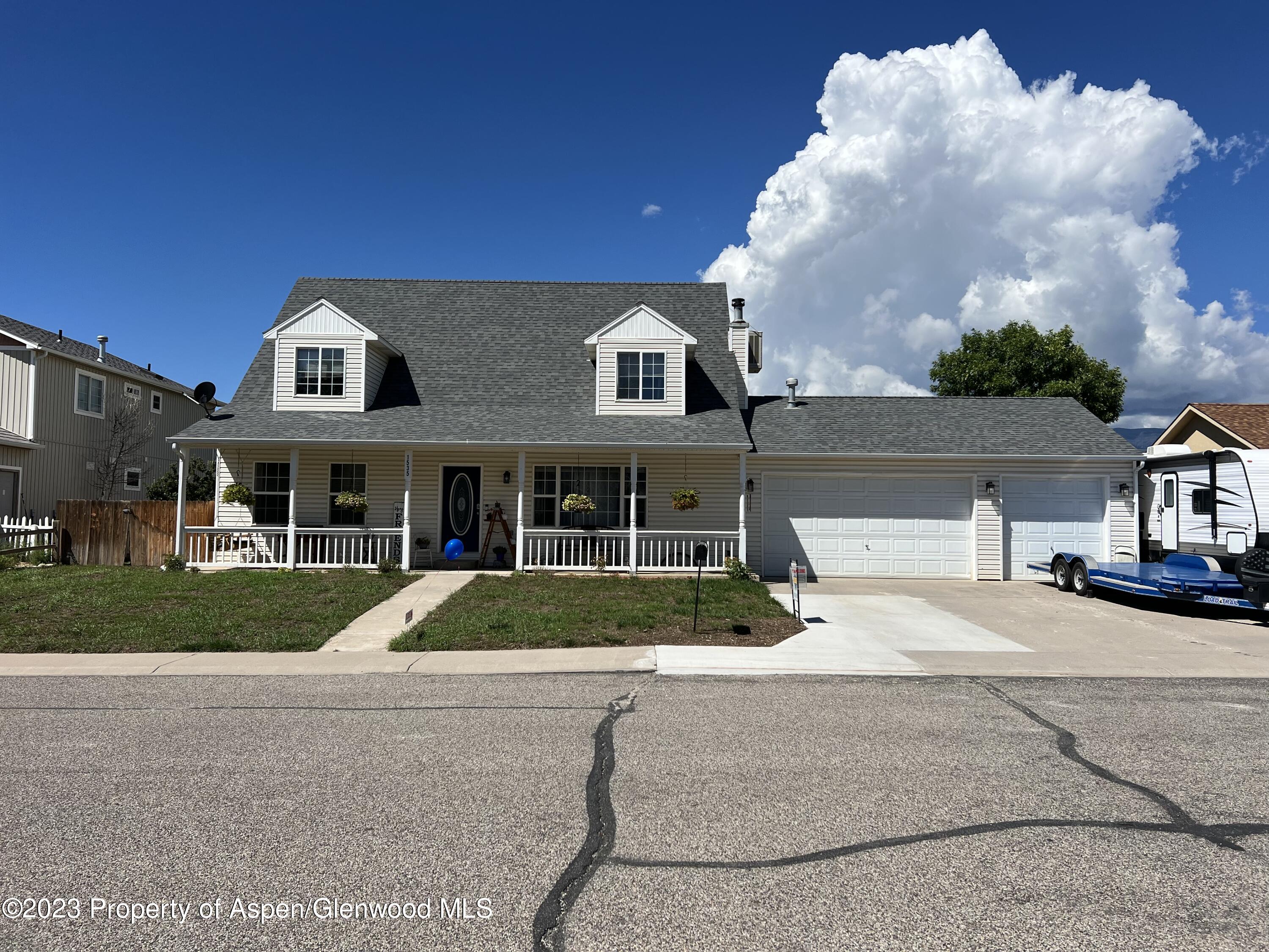 1535 Anvil View Avenue Rifle, CO 81650 - Photo 1 of 21 a front view of a house with garden
