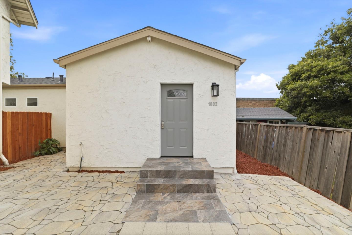 1802 Ponca Court Fremont, CA 94539 - Photo 4 of 28 a view of a house with wooden fence