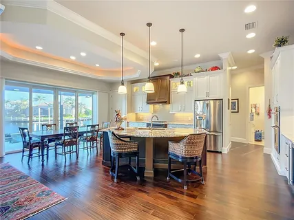 a kitchen with granite countertop a stove and a cabinets