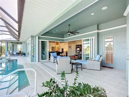 a small pool with lawn chairs