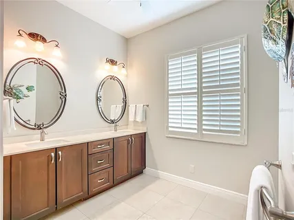 a bathroom with a granite countertop sink a mirror and a