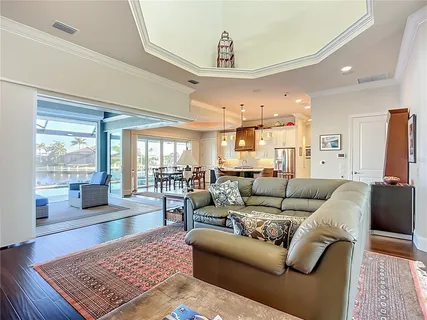a living room with furniture rug and window