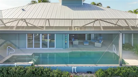 an aerial view of a house with a ocean view